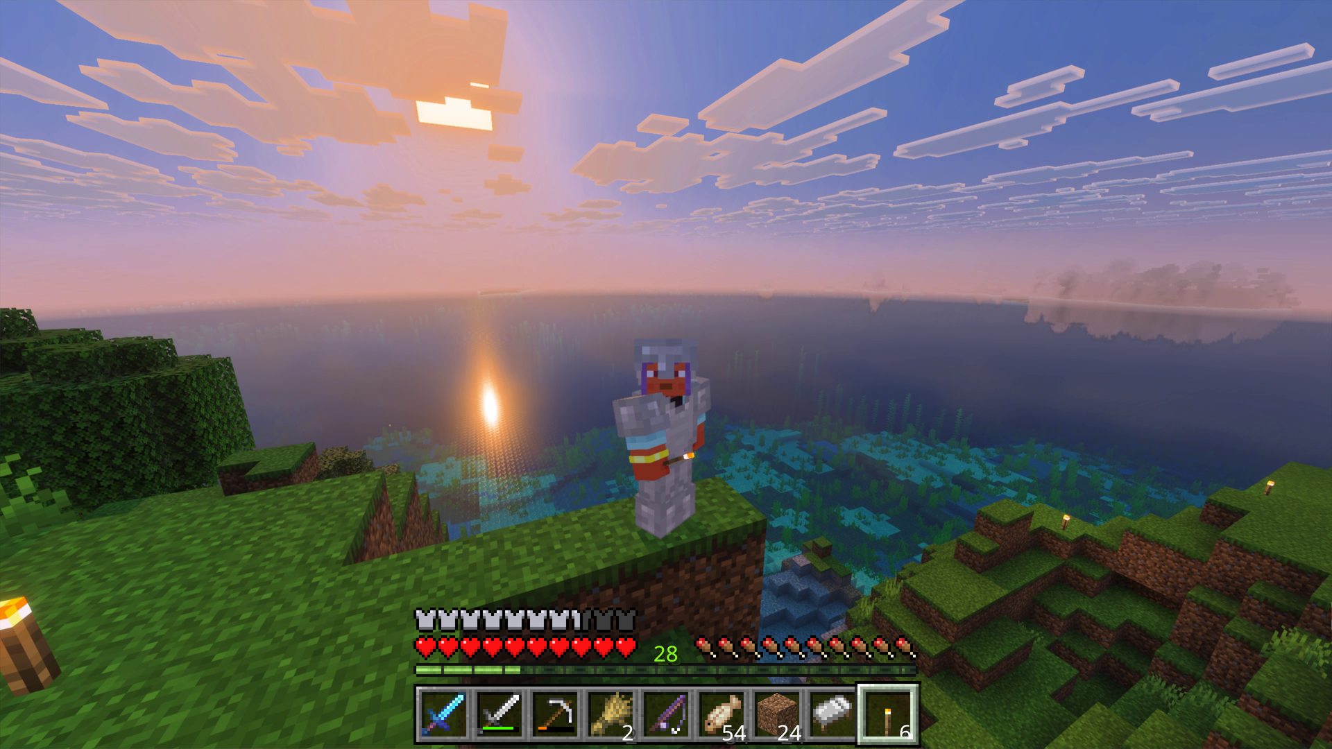 Minecraft player in iron armor overlooking a sunset ocean with reflections and the hotbar visible